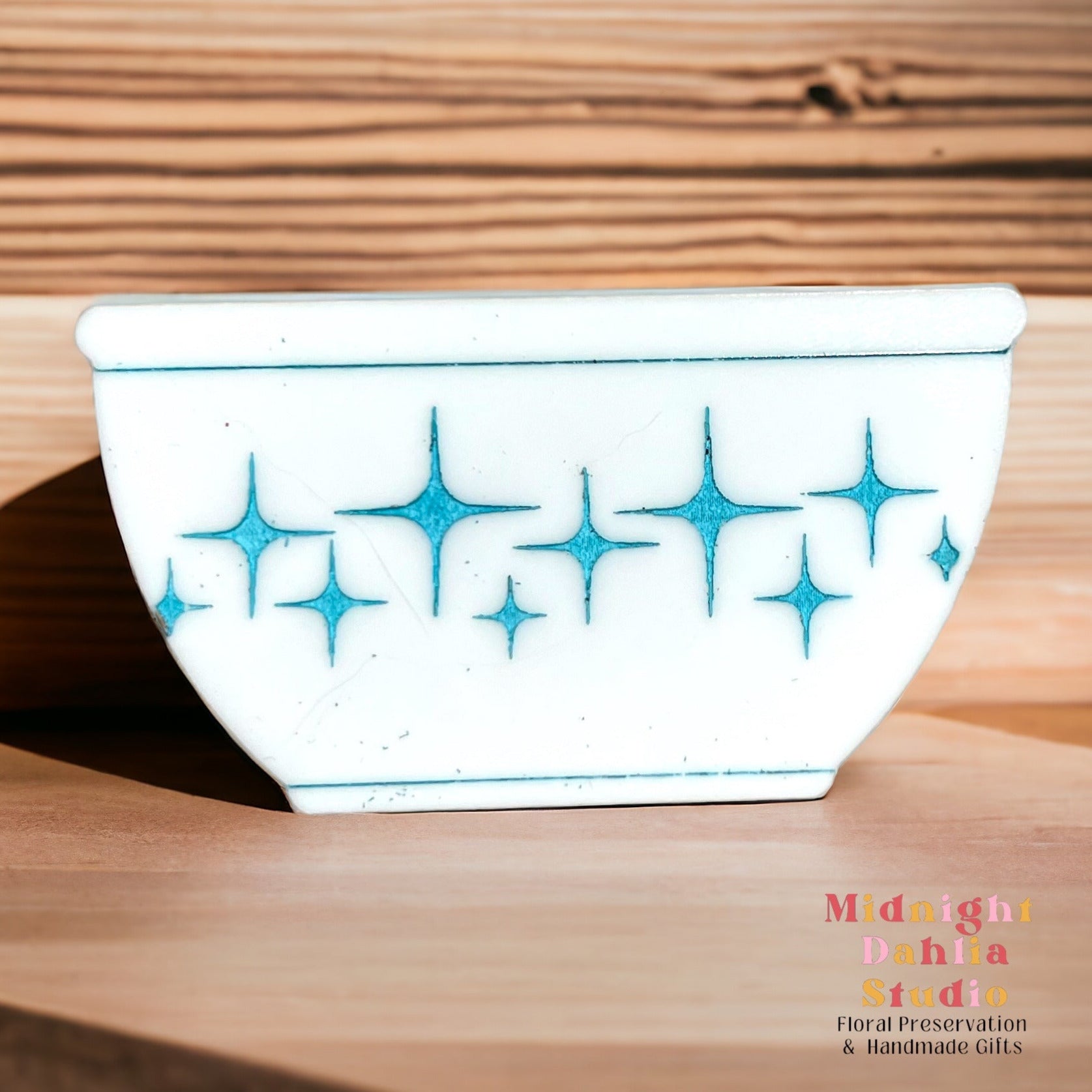 white bowl-shaped magnets that resemble vintage pyrex and corelle bowls