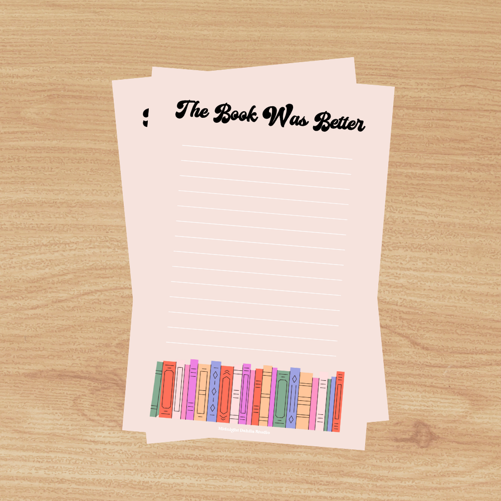 This 4"x6" notepad is made of high-quality paper, printed in house by Midnight Dahlia Studio.

It is a light pink and reads "The Book Was Better" with a stack of books along the bottom.  Each notepad contains 50 pages.