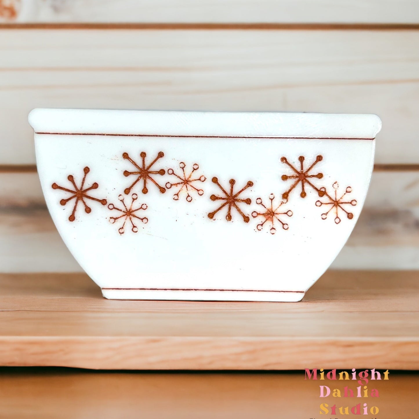 white bowl-shaped magnets that resemble vintage pyrex and corelle bowls