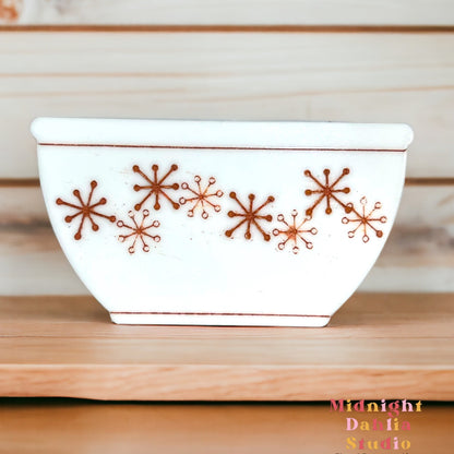 white bowl-shaped magnets that resemble vintage pyrex and corelle bowls