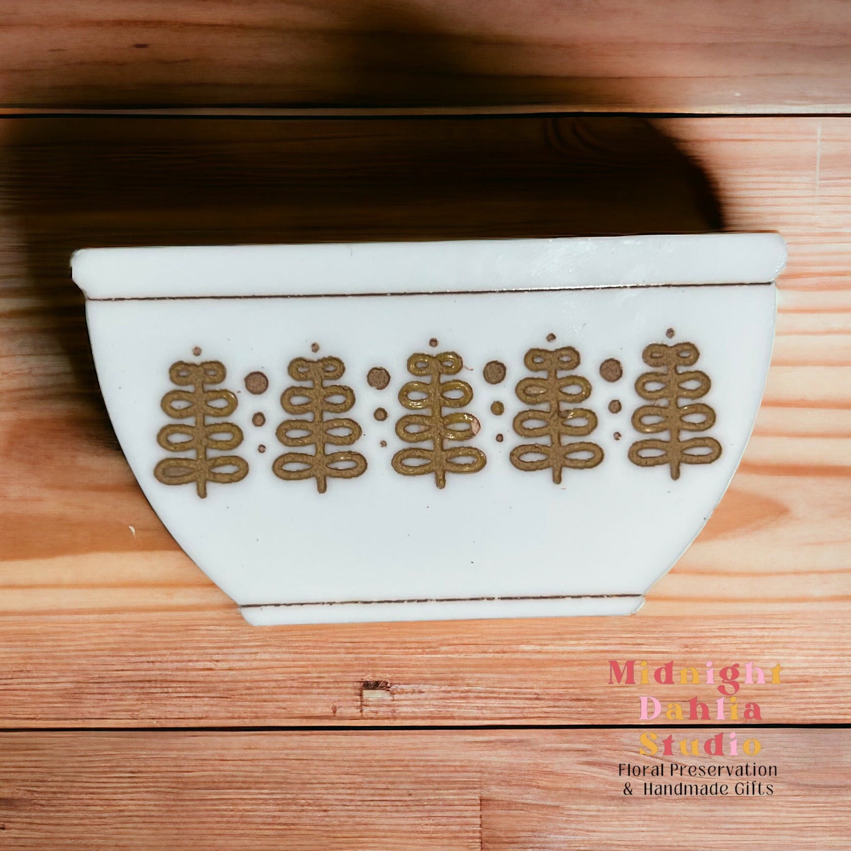 white bowl-shaped magnets that resemble vintage pyrex and corelle bowls