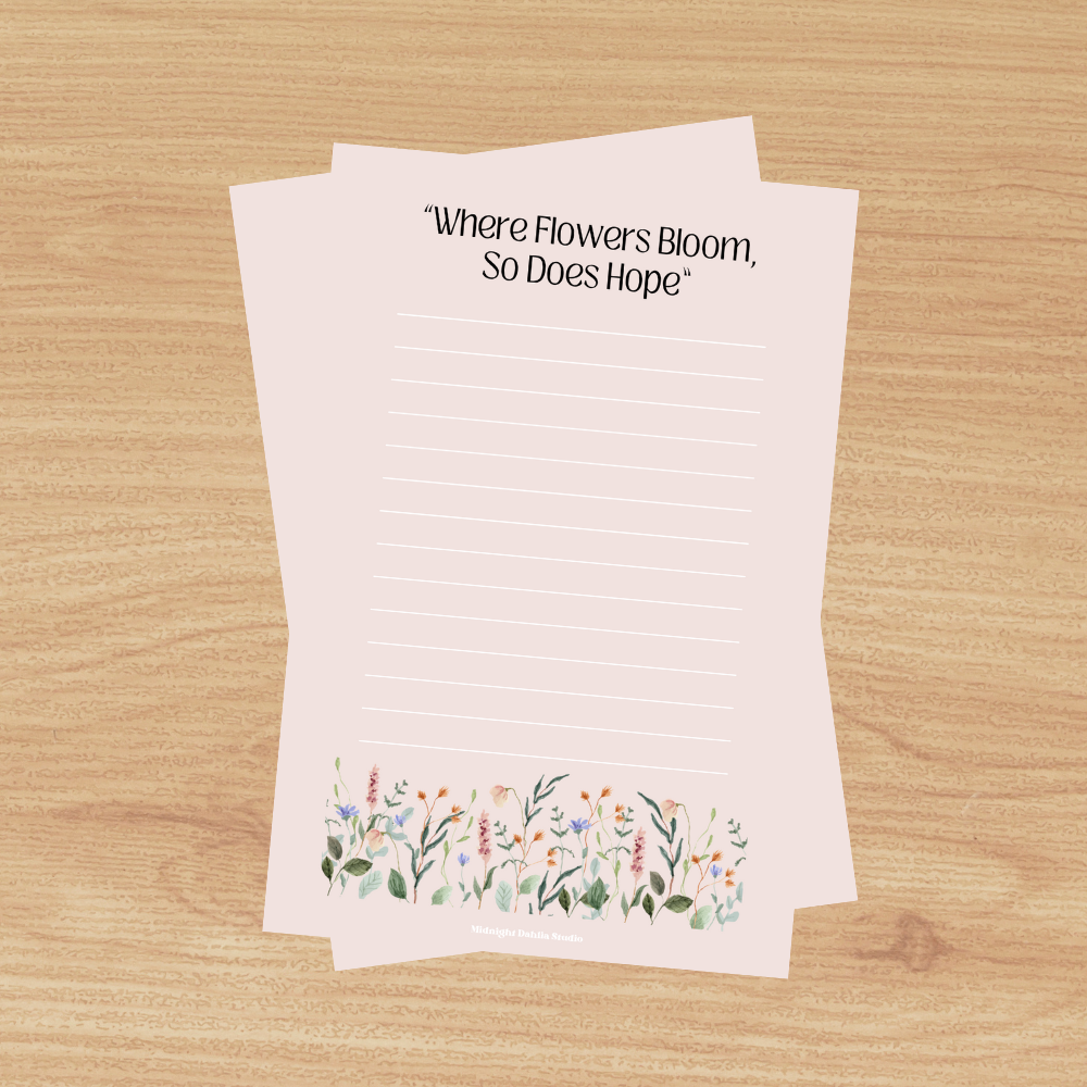 This 4"x6" notepad is made of high-quality paper, printed in house by Midnight Dahlia Studio.

It is beige and reads "Where Flowers Bloom So Does Hope" with a line of wildflowers along the bottom.  Each notepad contains 50 pages.