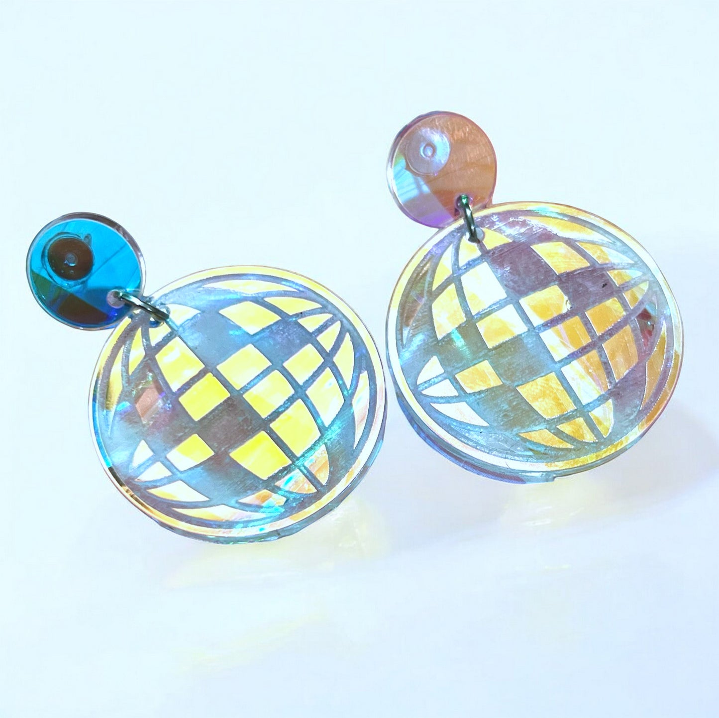 A pair of iridescent disco ball dangle earrings laser cut.  Beautiful jewelry for a woman or teen, especially for a music concert.