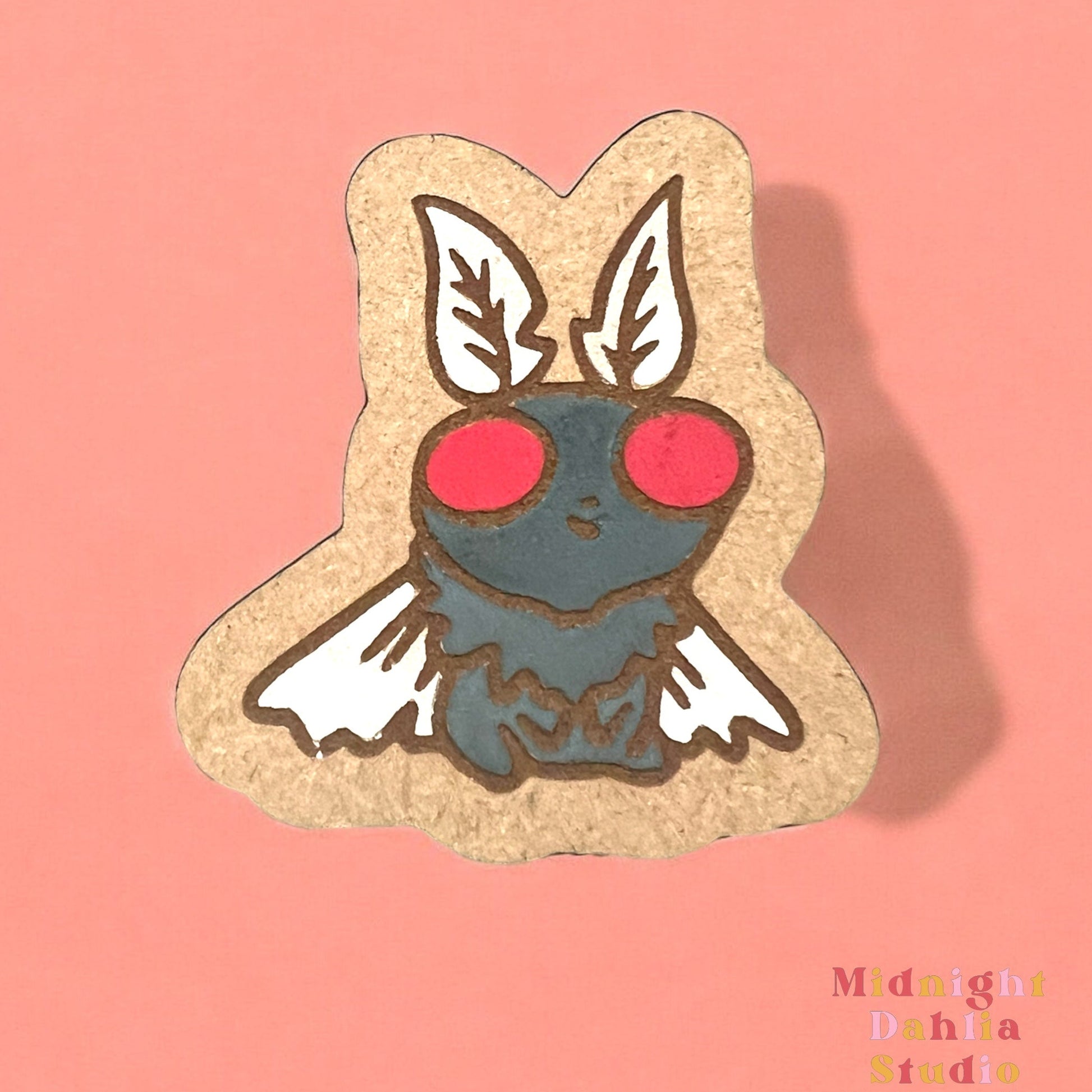 a cute mothman handpainted black with red eyes