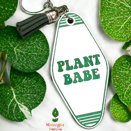 a retro motel keychain made of acrylic that reads plant babe