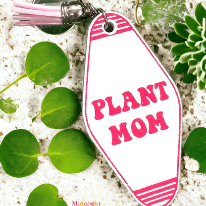 a retro motel keychain made of acrylic that reads plant mom