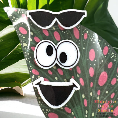 a set of three plant personality magnets in sunglasses, googly eyes, and a open mouth smile