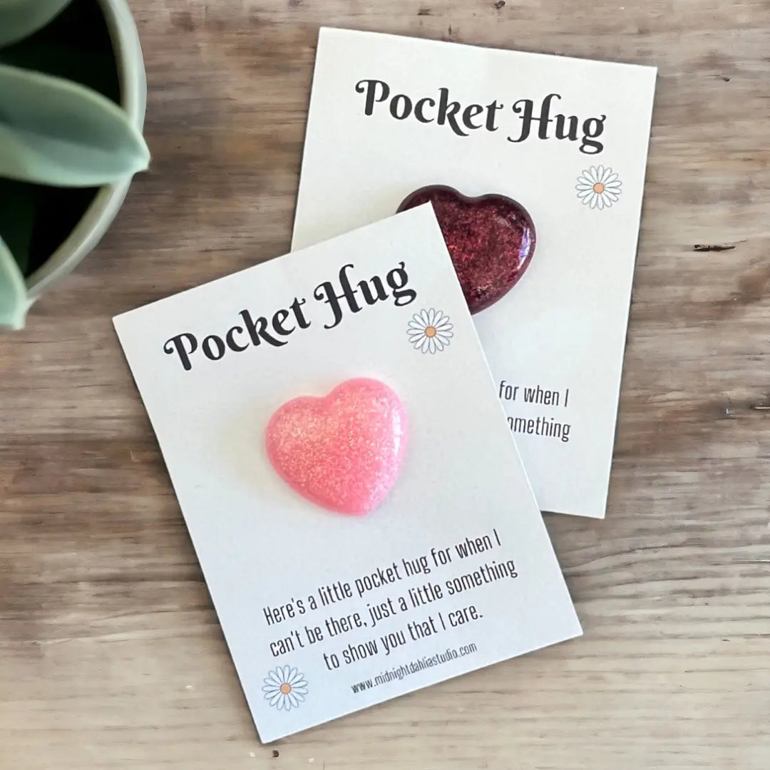 a set of two pocket hugs in red and light pink, each on a card with an encouraging poem