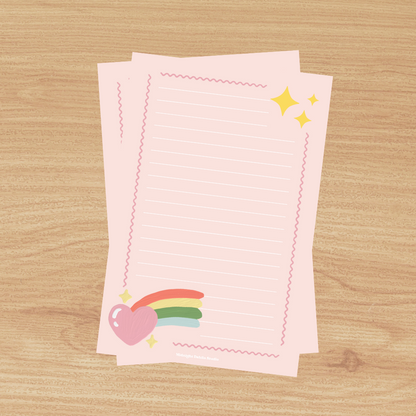 This 4"x6" notepad is made of high-quality paper, printed in house by Midnight Dahlia Studio.

It is pink and has a rainbow heart at the bottom.  Each notepad contains 50 pages.