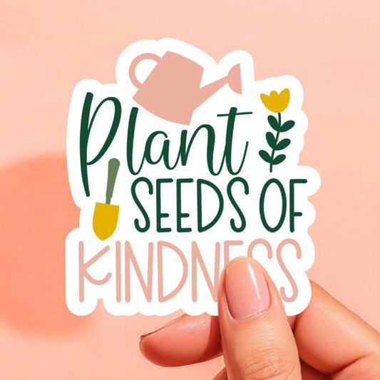 a white sticker that reads plant seeds of kindness with a watering can, garden shovel, and tulip