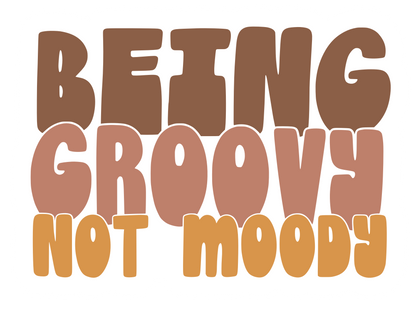 sticker with a white background that reads being groovy not moody.  being is brown, groovy is mauve, and not moody is mustard yellow.  the font is reminiscent of the 70's and retro.